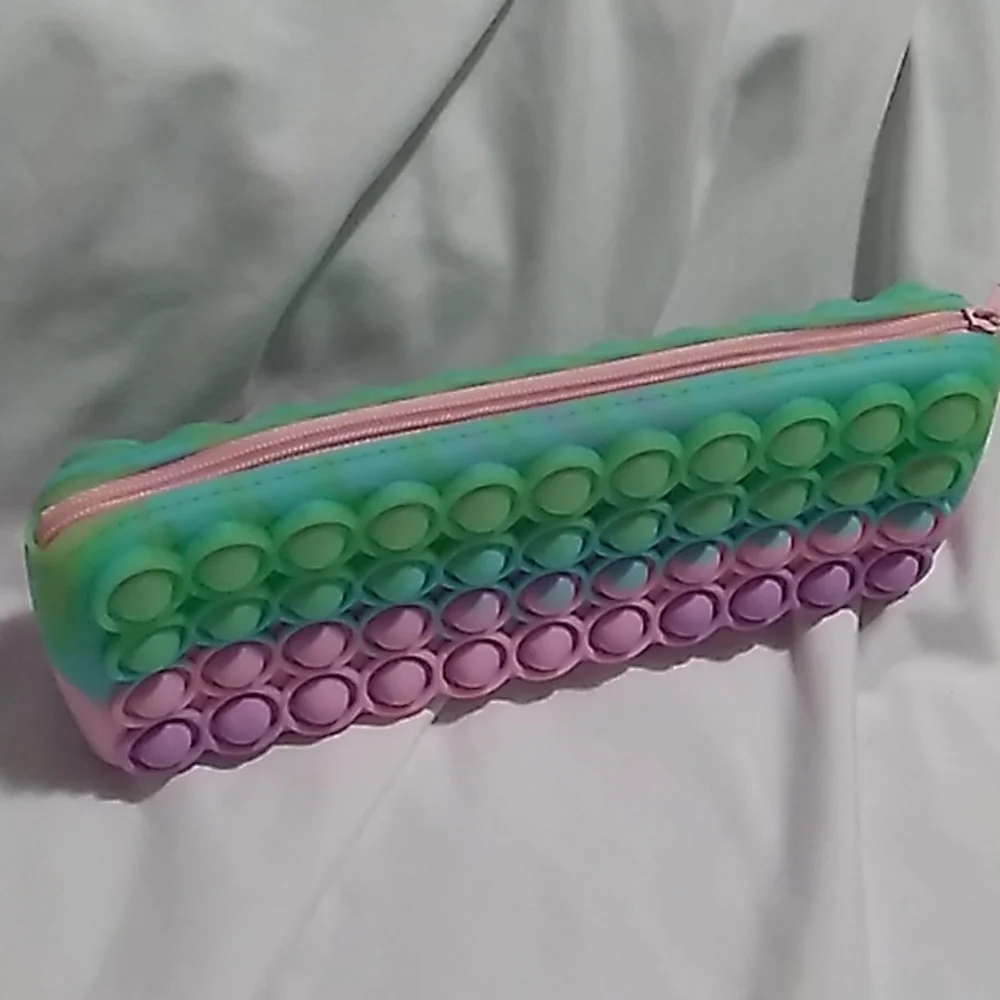 8 x 3 x 1 1/4 inches Purple, pink & green Pop It Case